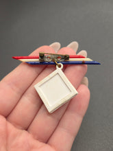 Load image into Gallery viewer, 1940s World War Two Red, White and Blue Celluloid Soldier Brooch
