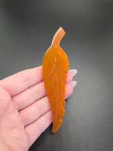 Load image into Gallery viewer, 1930s HUGE Butterscotch Carved Bakelite Curved Leaf Dress Clip
