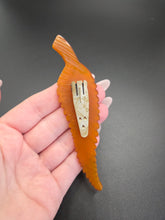 Load image into Gallery viewer, 1930s HUGE Butterscotch Carved Bakelite Curved Leaf Dress Clip
