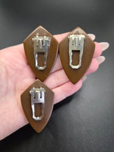 Load image into Gallery viewer, 1940s Chocolate Brown Carved Bakelite Triple Dress Clip Set
