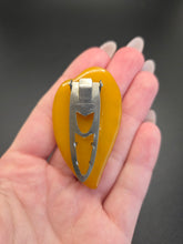Load image into Gallery viewer, 1940s Carved Egg Yolk Bakelite Dress Clip
