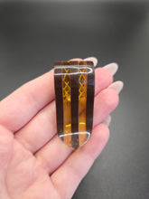 Load image into Gallery viewer, 1940s Brown and Apple Juice Laminated Bakelite Dress Clip
