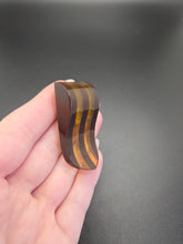 Load image into Gallery viewer, 1940s Brown and Apple Juice Laminated Bakelite Dress Clip
