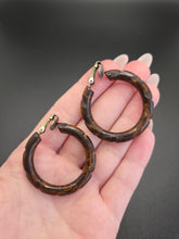 Load image into Gallery viewer, 1940s Marbled Brown Carved Bakelite Hoop Earrings
