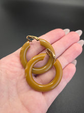 Load image into Gallery viewer, 1940s Olive Green/Mustard Carved Bakelite Earrings
