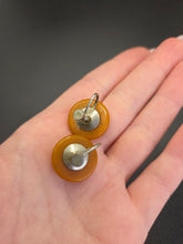 Load image into Gallery viewer, 1940s Carved Orange Bakelite Earrings
