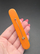 Load image into Gallery viewer, 1940s Orange Carved Bakelite Bar Brooch
