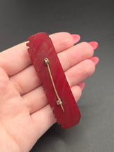 Load image into Gallery viewer, 1940s Carved Red Bakelite Bar Brooch
