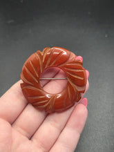 Load image into Gallery viewer, 1940s Rust Bakelite Carved Circle Brooch
