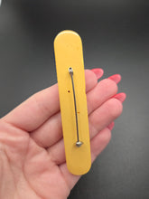 Load image into Gallery viewer, 1940s Yellow Carved Bakelite Bar Brooch
