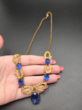 Load image into Gallery viewer, 1910s/1920s American Blue Open Back Glass Metal Necklace
