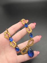 Load image into Gallery viewer, 1910s/1920s American Blue Open Back Glass Metal Necklace
