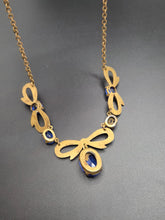 Load image into Gallery viewer, 1910s/1920s American Blue Open Back Glass Metal Necklace
