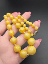 Load image into Gallery viewer, 1940s Bright Yellow Satin Glass Knotted Necklace
