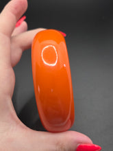 Load image into Gallery viewer, 1940s Chunky Bright Orange Bakelite Bangle

