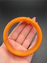 Load image into Gallery viewer, 1940s Marbled Orange Bakelite Bangle
