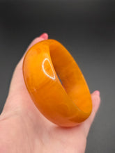 Load image into Gallery viewer, 1940s Marbled Orange Bakelite Bangle
