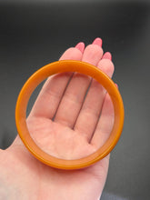 Load image into Gallery viewer, 1940s Huge Thin Orange Bakelite Bangle A
