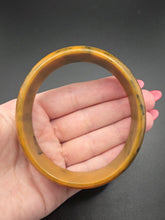 Load image into Gallery viewer, 1940s Mustard and Dark Green Marbled Egg Shape Bakelite Bangle
