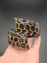 Load image into Gallery viewer, 1950s Black and Gold Confetti Lucite Clamper Bangle
