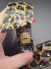 Load image into Gallery viewer, 1950s Black and Gold Confetti Lucite Clamper Bangle
