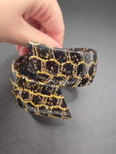 Load image into Gallery viewer, 1950s Black and Gold Confetti Lucite Clamper Bangle
