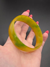 Load image into Gallery viewer, 1940s Bright Yellow and Green Marbled Thin Bakelite Bangle
