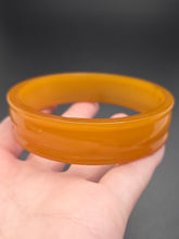 Load image into Gallery viewer, 1940s Unusual Orange Bakelite Bangle
