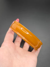 Load image into Gallery viewer, 1940s Unusual Orange Bakelite Bangle
