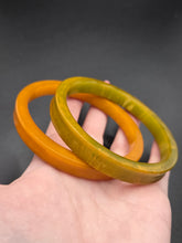 Load image into Gallery viewer, 1940s Curved Marbled Green and Orange Bakelite Bangle Set
