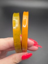 Load image into Gallery viewer, 1940s Curved Marbled Green and Orange Bakelite Bangle Set
