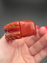 Load image into Gallery viewer, 1940s Dark Caramel Carved Bakelite Clamper
