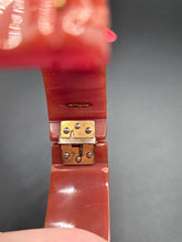 Load image into Gallery viewer, 1940s Dark Caramel Carved Bakelite Clamper
