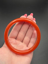 Load image into Gallery viewer, 1940s Brick Red Almost Sheer Bakelite Bangle
