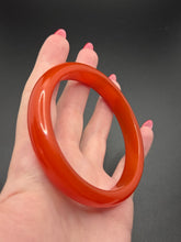 Load image into Gallery viewer, 1940s Brick Red Almost Sheer Bakelite Bangle
