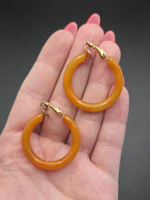 Load image into Gallery viewer, 1940s Orange Bakelite Clip Hoop Earrings
