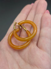 Load image into Gallery viewer, 1940s Orange Bakelite Clip Hoop Earrings
