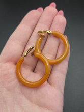 Load image into Gallery viewer, 1940s Orange Bakelite Clip Hoop Earrings
