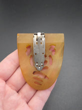 Load image into Gallery viewer, 1940s Cloudy Apple Juice Carved Bakelite Dress Clip
