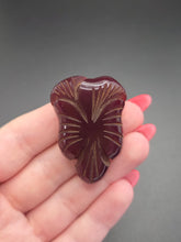Load image into Gallery viewer, 1940s Dark Red Carved Bakelite Dress Clip
