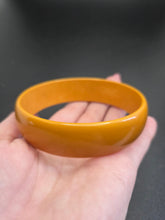 Load image into Gallery viewer, 1940s Dark Yellow/Orange Egg Shaped Bakelite Bangle
