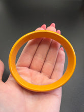 Load image into Gallery viewer, 1940s Dark Yellow/Orange Egg Shaped Bakelite Bangle
