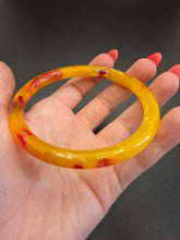 Load image into Gallery viewer, 1930s Bright Marbled Orange and Yellow Galalith Bangle
