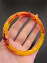 Load image into Gallery viewer, 1930s Bright Marbled Orange and Yellow Galalith Bangle
