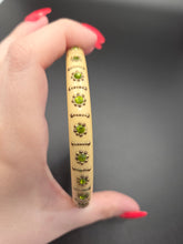 Load image into Gallery viewer, 1920s Thick Celluloid and Green Rhinestone Upper Arm Bangle
