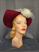 Load image into Gallery viewer, 1940s Dark Raspberry Red Felt Halo Hat With Huge Ostrich Feather
