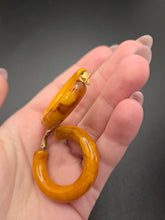 Load image into Gallery viewer, 1940s Chunky Yellow Orange Marbled Bakelite Hoop Earrings
