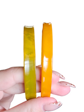 Load image into Gallery viewer, 1940s Curved Marbled Green and Orange Bakelite Bangle Set
