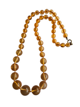 Load image into Gallery viewer, 1950s Long Peach Knotted Lucite Necklace
