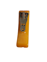 Load image into Gallery viewer, 1940s Butterscotch Carved Bakelite Curved Dress Clip

